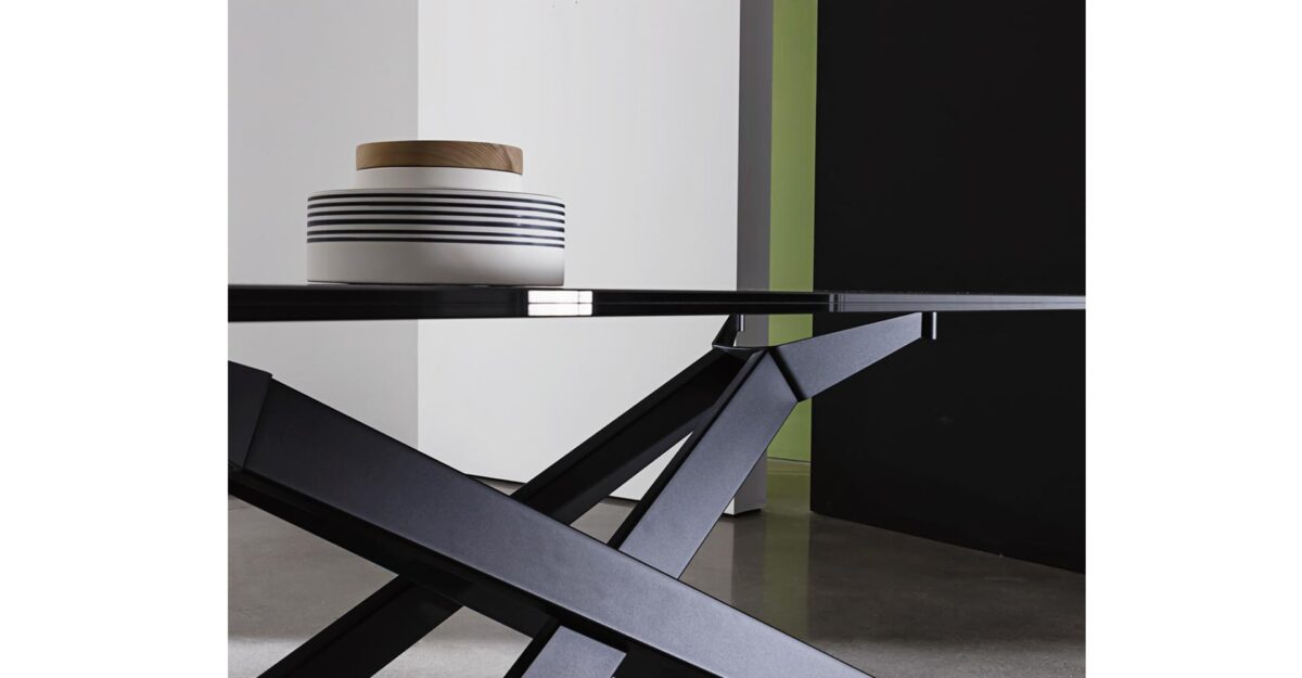 “Modern statement table – Cross by Sovet with dynamic intersecting base and elegant surface finish”
