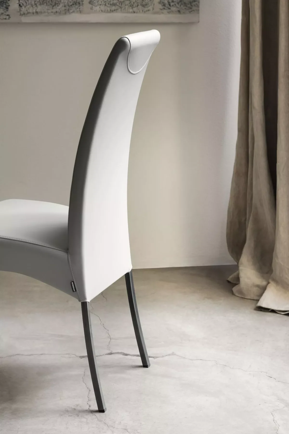 .Modern dining room showcasing Aida chair by Bontempi