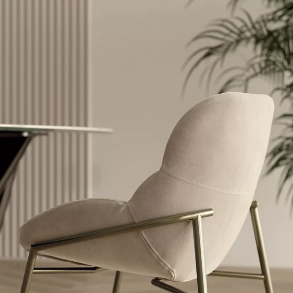 “Amelie chair by Bontempi – upholstered in premium leather with a gently curved shell and sleek dark metal tapered legs.”