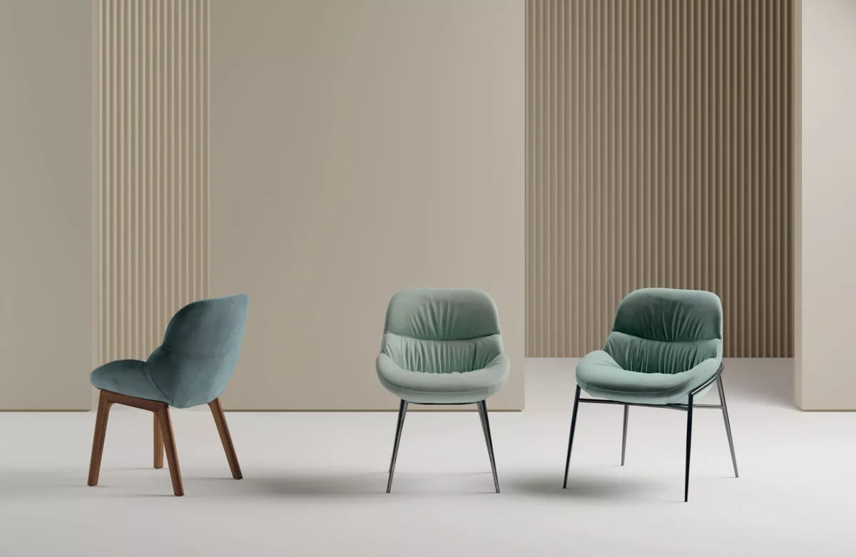 “Three-quarter angle of Amelie chair with solid walnut wood legs and elegant fabric-covered seat.”