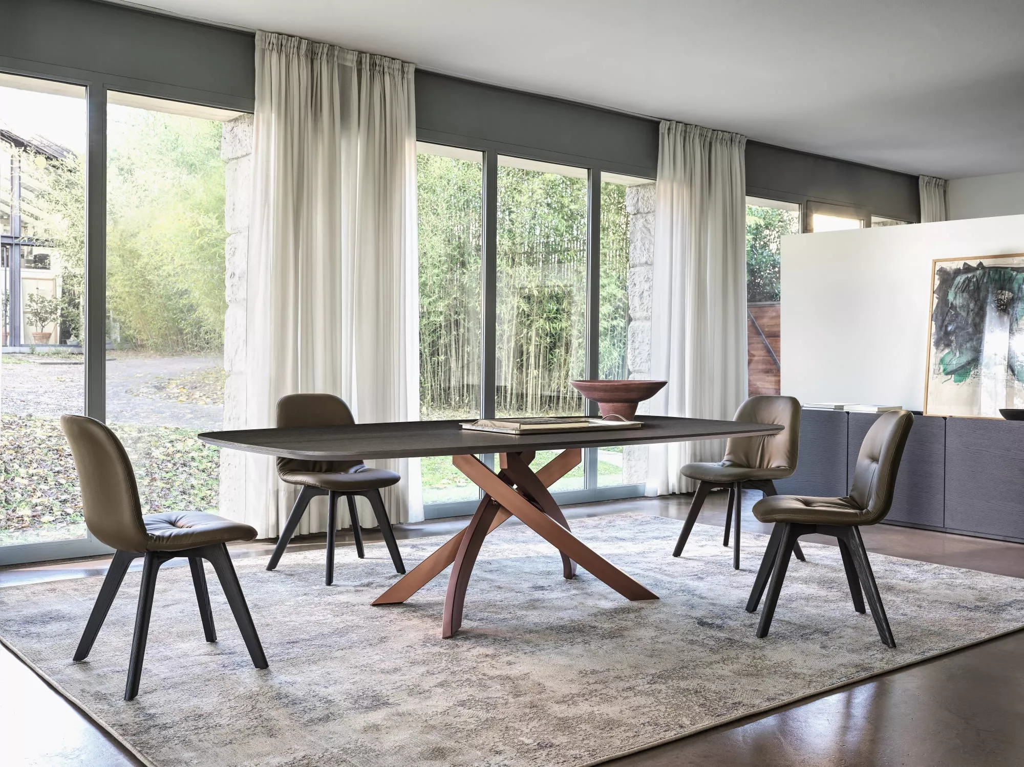 Chantal dining chair by Bontempi in Royal Oak, Michigan – Upholstered seat with tufted accents and angled metal legs.