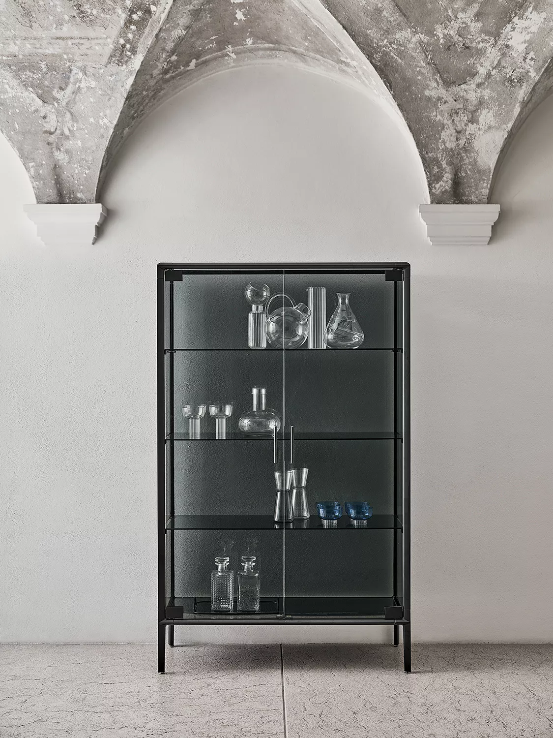 Modern Audrey display cabinet by Bontempi in Royal Oak, MI featuring transparent glass panels and dark brass frame.