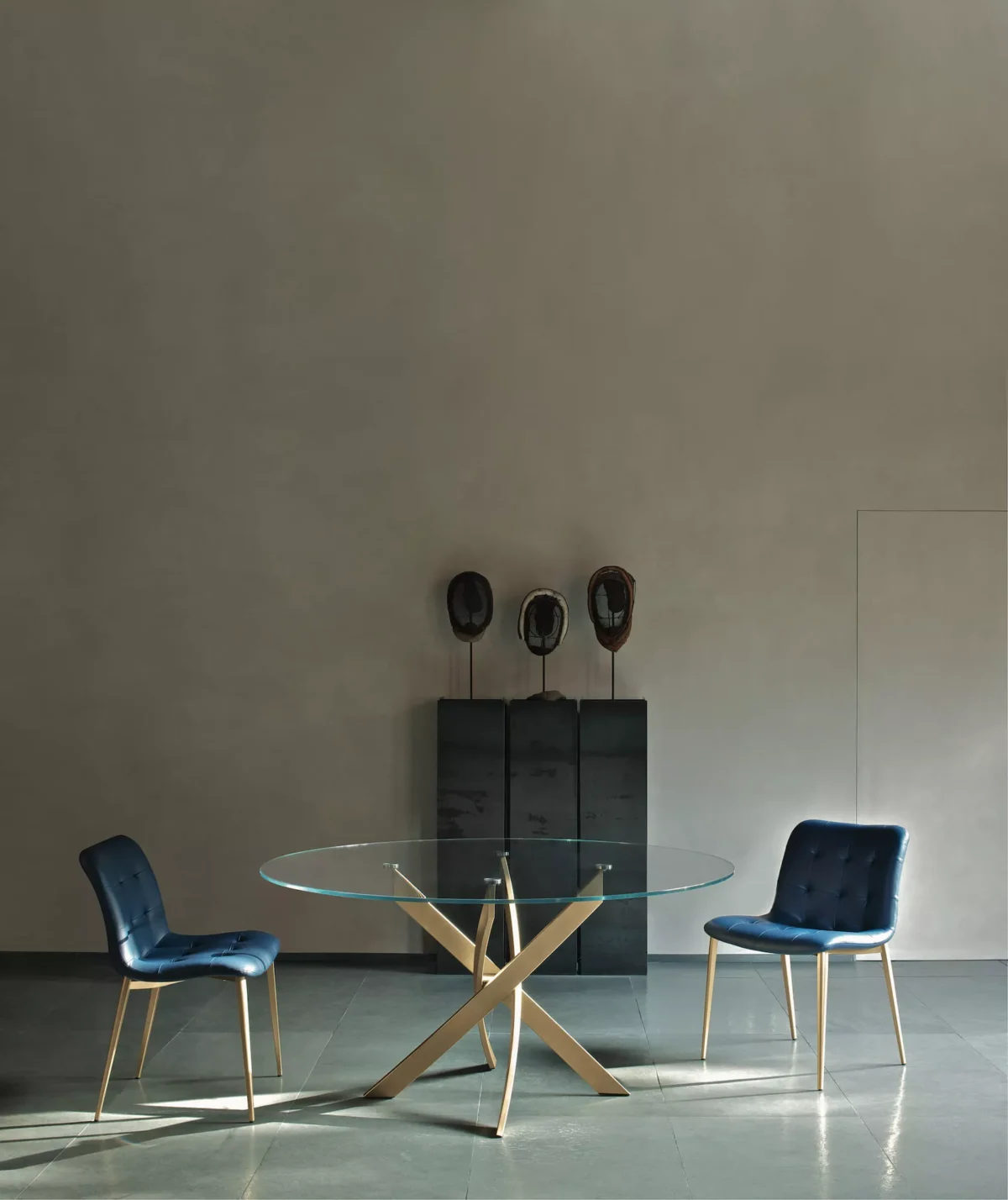 Bontempi Plague table paired with upholstered dining chairs