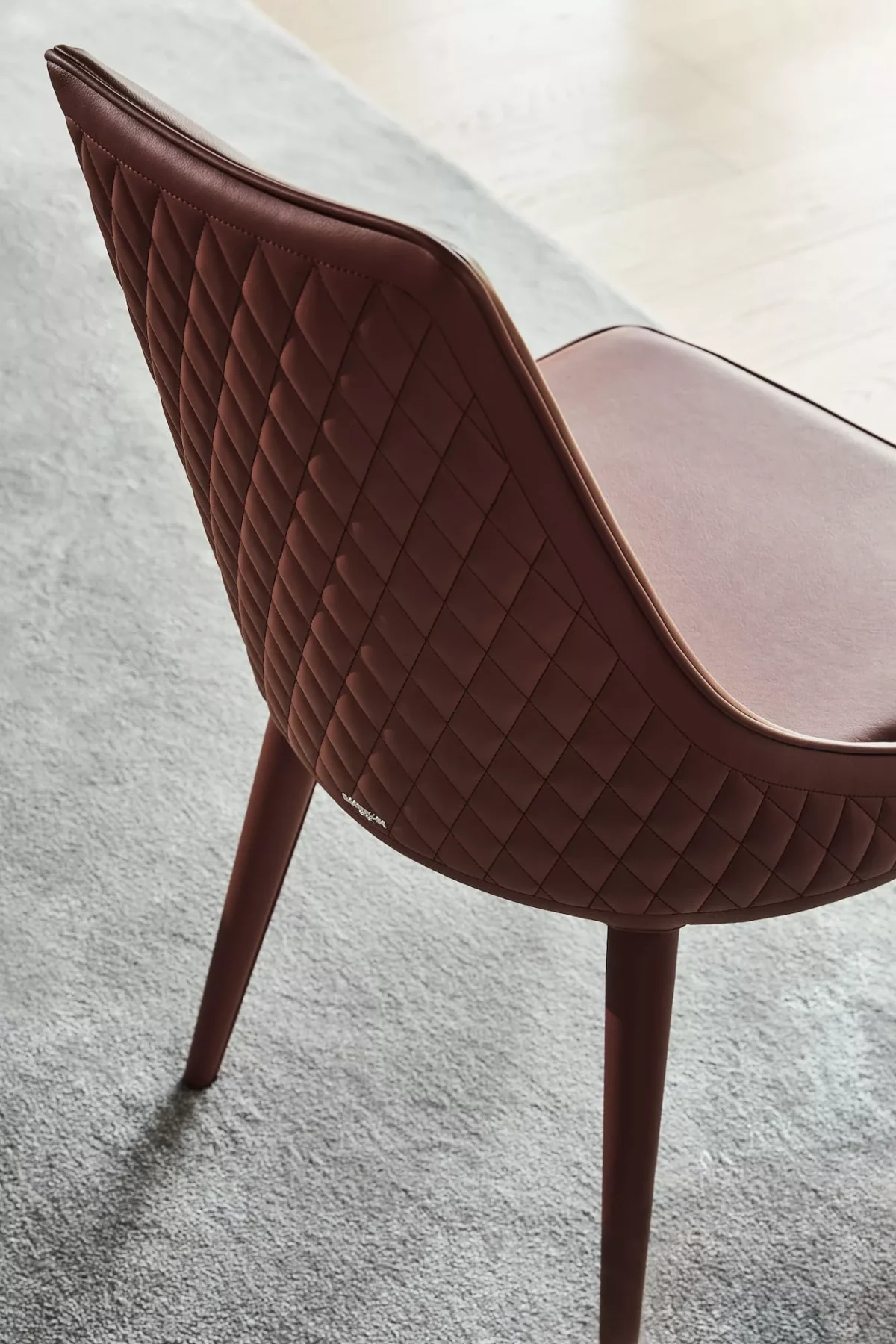 Clara by Bontempi dining chair with gently curved backrest and slender legs