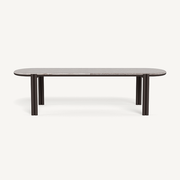 “Cove pill-shaped table in coastal setting – elegant and weather-resistant aluminum”