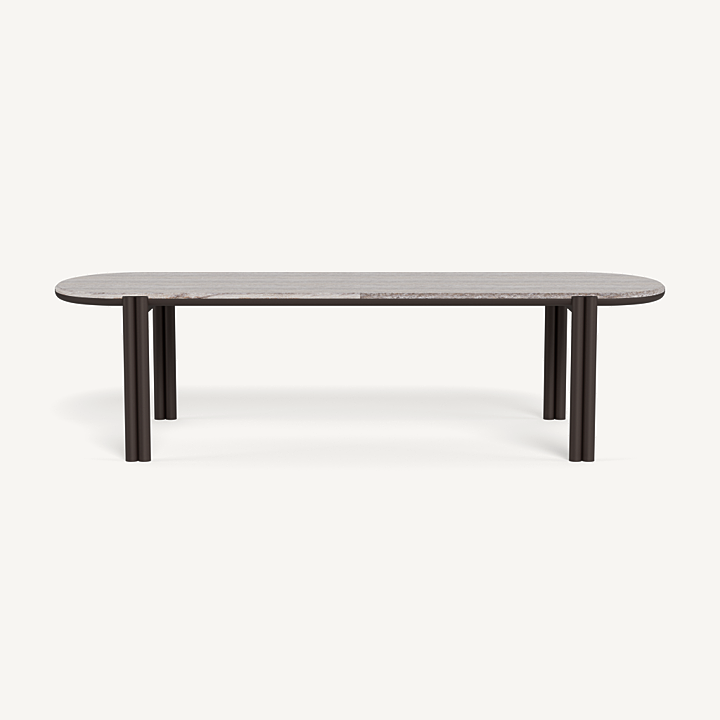 “Cove pill-shaped table in coastal setting – elegant and weather-resistant aluminum”