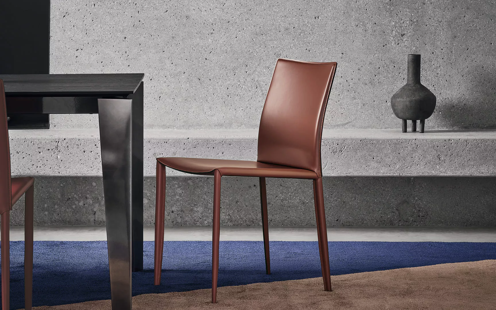 Linda by Bontempi chair with softly curved upholstered backrest and slender metal legs