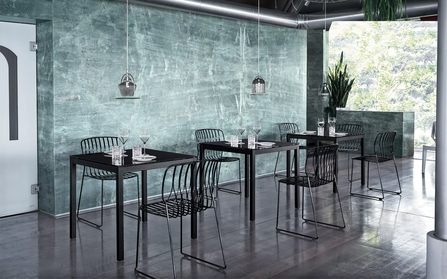 Modern Sharp table with glossy white SuperCeramic surface and slim sand-finished steel frame in a bright contemporary room.