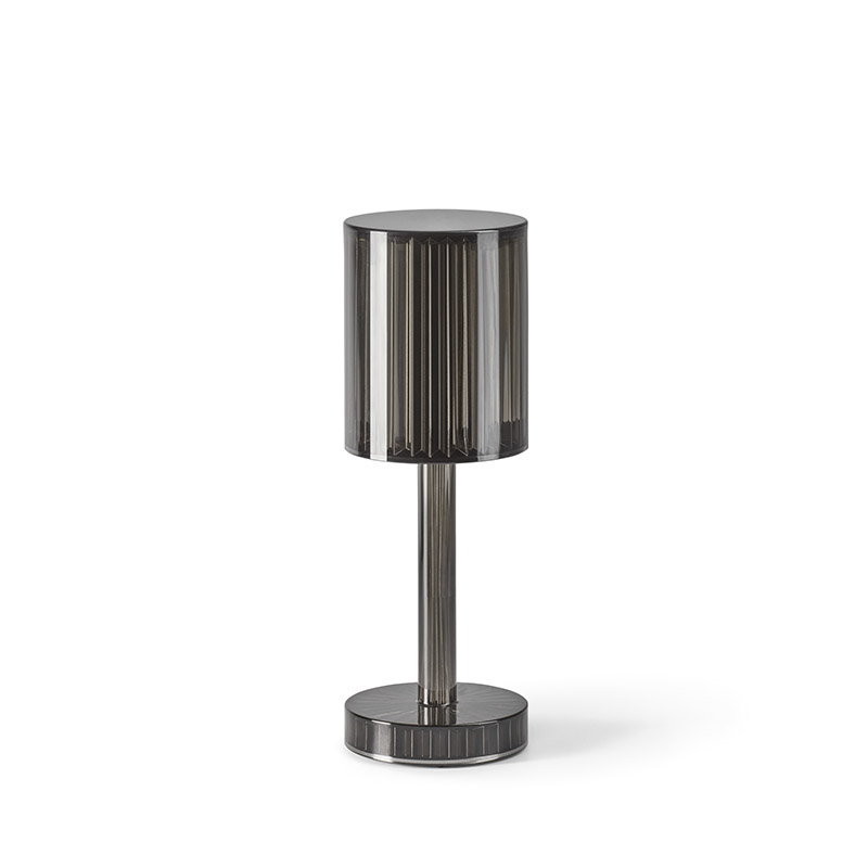 Elegant cylinder-shaped designer lamp on a modern interior table