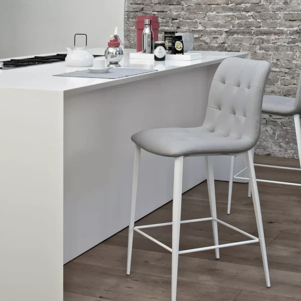 Kuga footstool by Bontempi in Royal Oak, MI featuring a quilted upholstered seat and sleek metal frame.