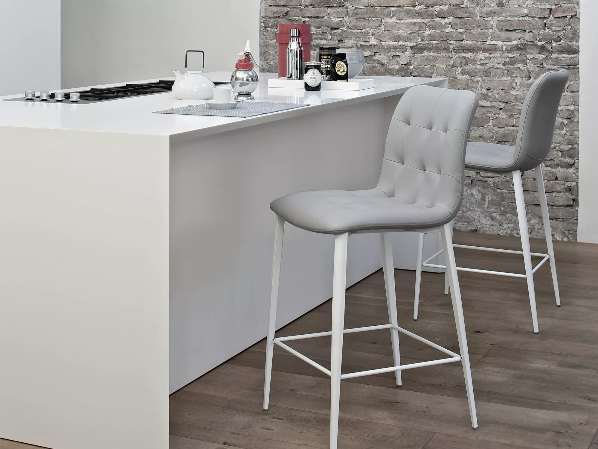 Kuga footstool by Bontempi in Royal Oak, MI featuring a quilted upholstered seat and sleek metal frame.