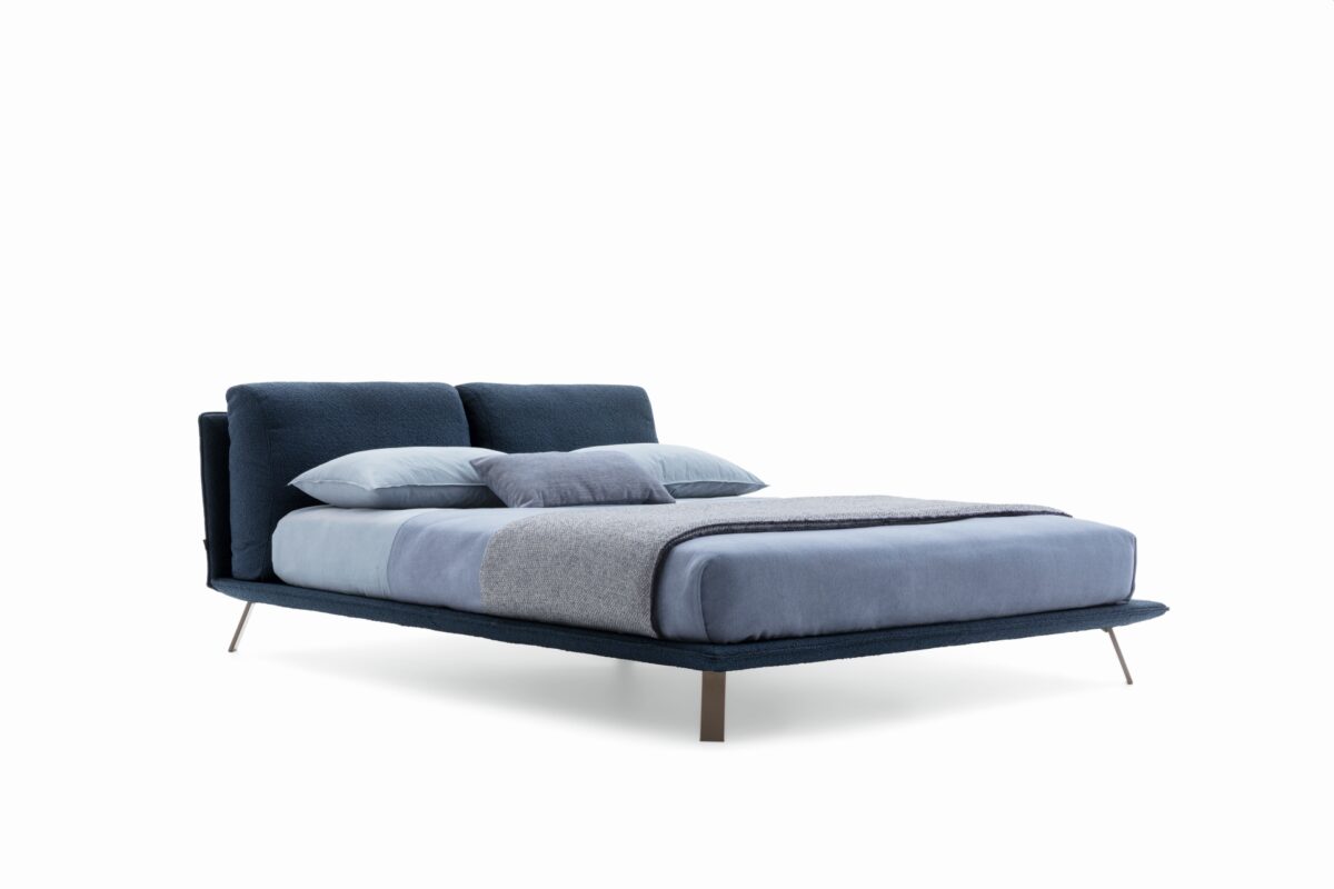 “Ditre Italia Kanaha bed – minimalist platform bed combining soft fabric panels with lightweight structure”