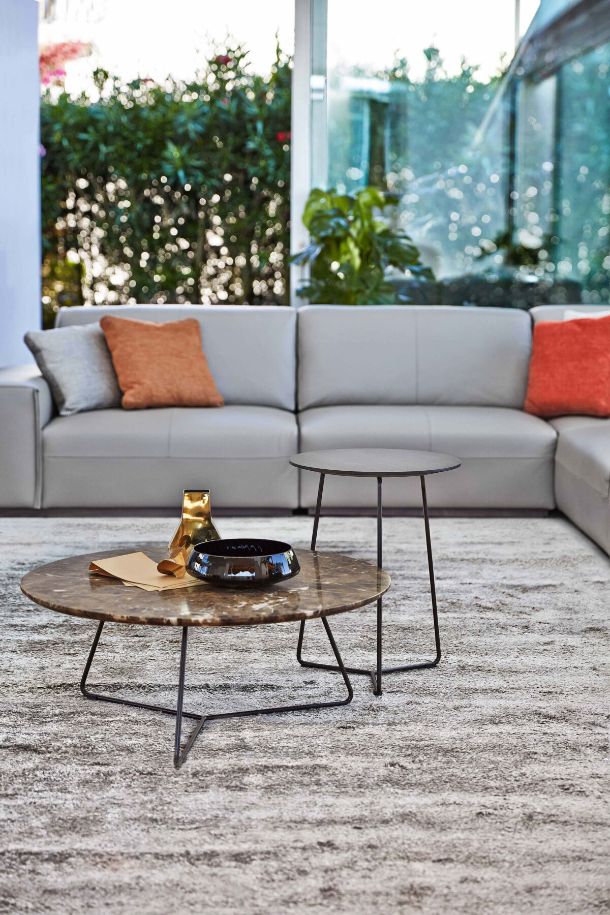 “Ditre Italia Kevin – contemporary coffee table featuring round top and architectural cross-frame structure”