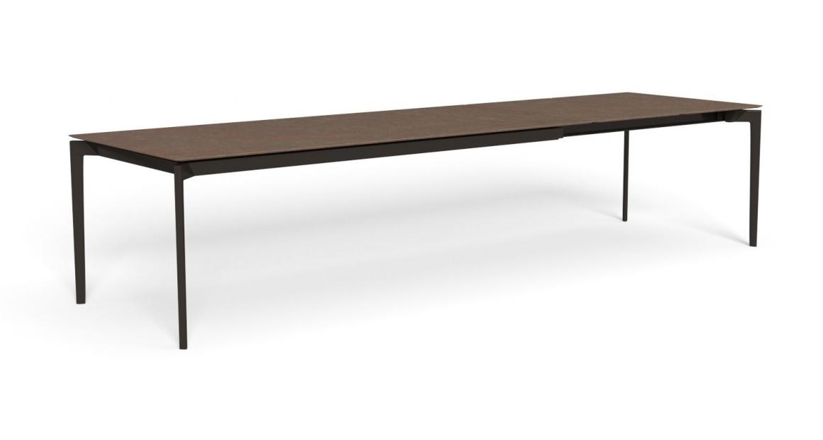 "Elegant extending table Leaf by TalentiSpa ideal for adaptable patio or terrace setups."