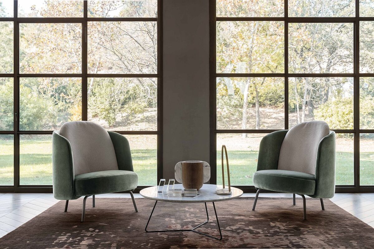 “Ditre Italia LUCIA – modern designer armchair featuring curved silhouette, tailored fabric, and minimalist base”