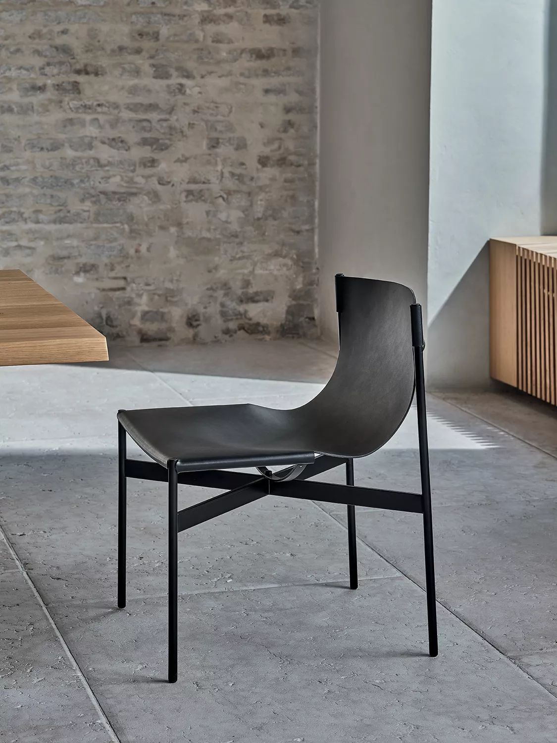 Lucrezia dining chair by Bontempi in Royal Oak, Michigan – Full-grain leather seat with a sleek metal frame.
