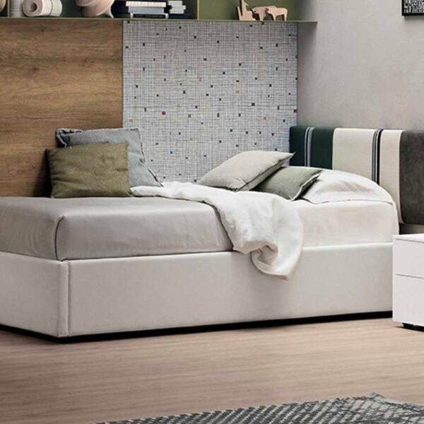 “Diagonal single bed by Tomasella – modern Italian youth bed with angled upholstered headboard and sleek frame”