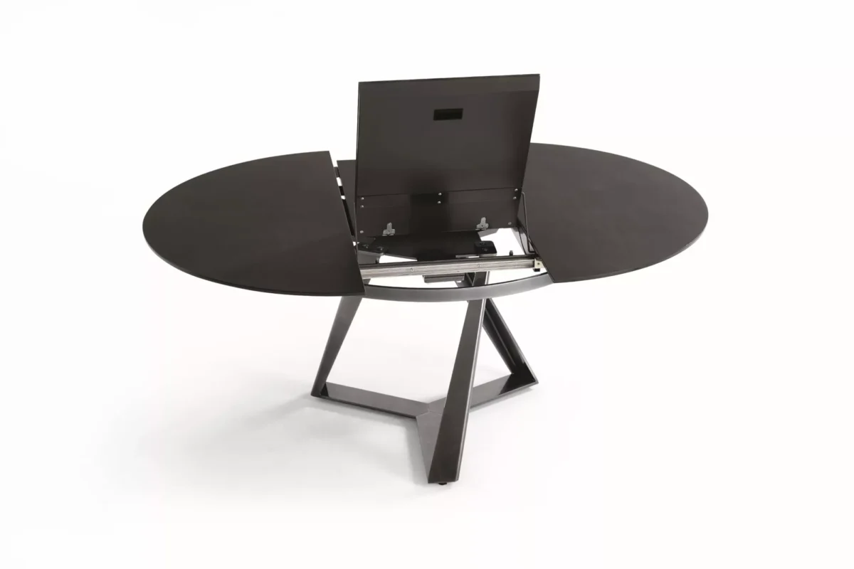 Side angle of Millennium Round by Bontempi showing the bold X‑style metal legs under a Dove‑grey velvet‑matt crystal top.