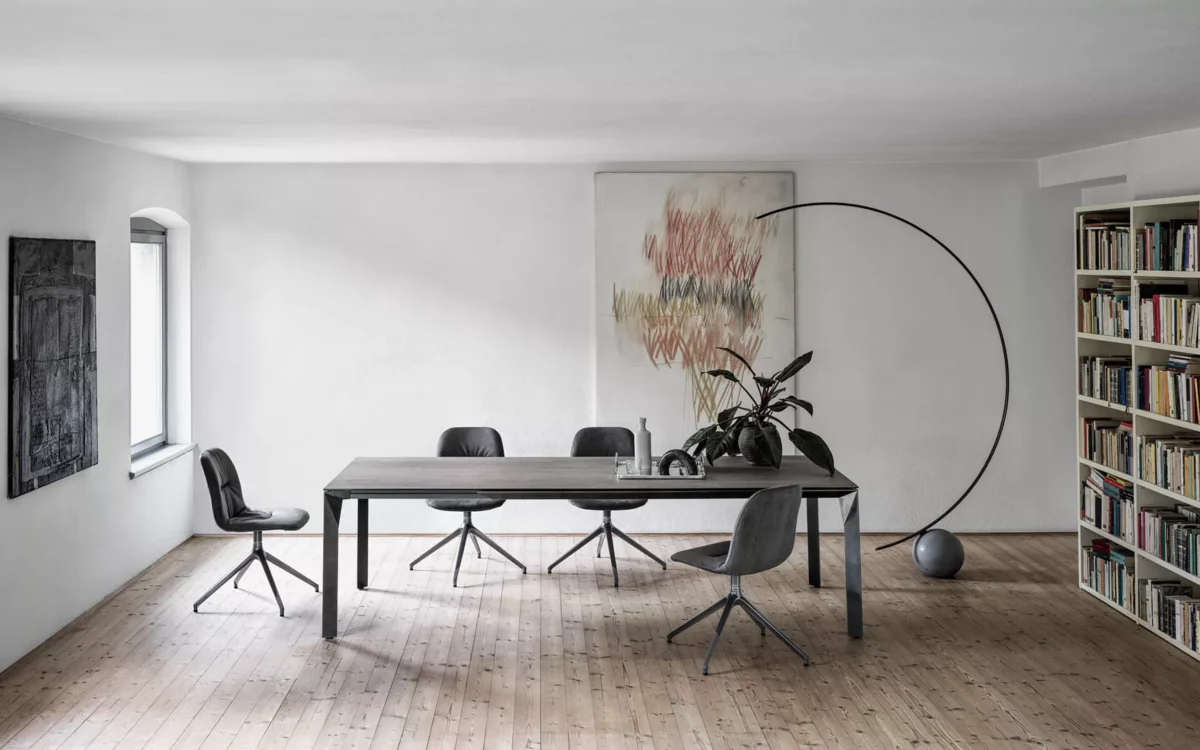 Bontempi Chantal chair, a modern Italian dining chair featuring a sleek silhouette with tufted accents and angled metal legs or a sled base. Upholstered in