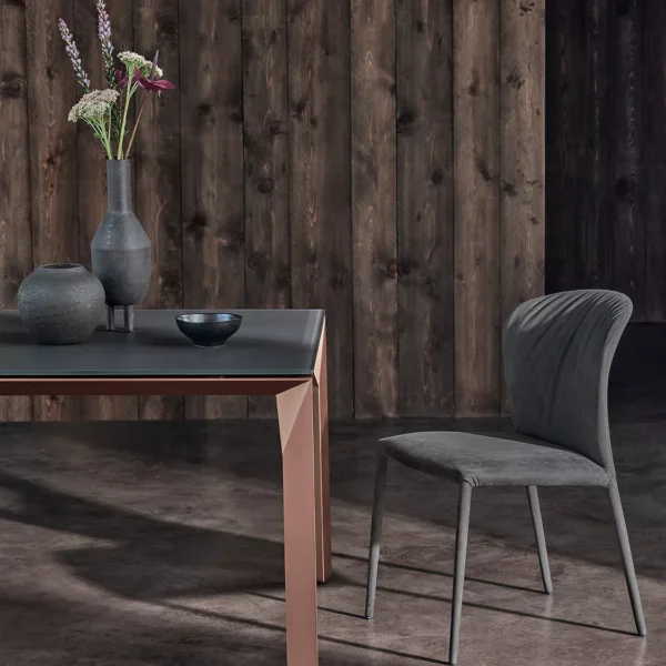 “Grace chair by Bontempi in forest green velvet, featuring a fully upholstered shell version with covered legs and plush seating.”