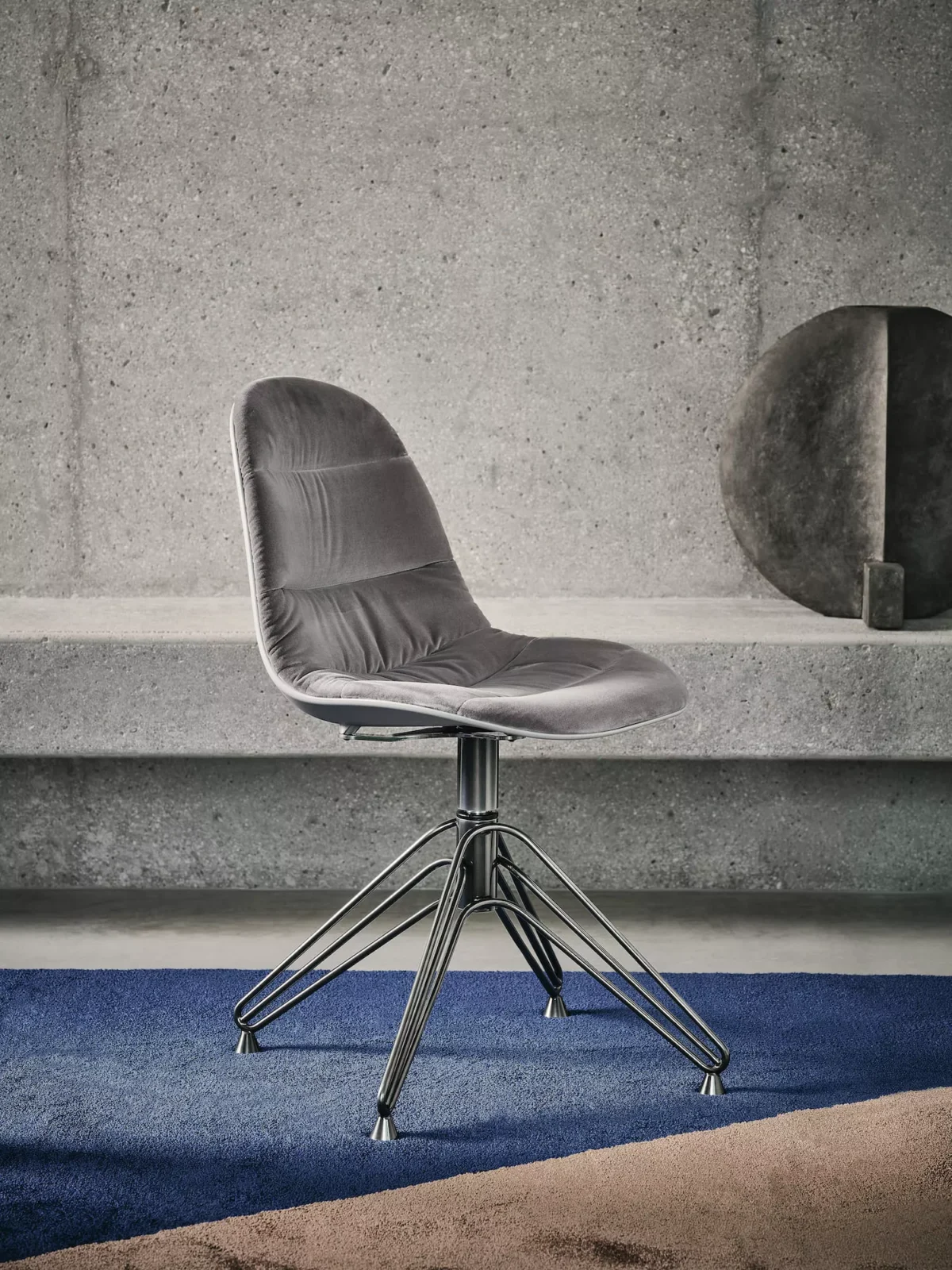 Mood Footstool Lined by Bontempi in Royal Oak, MI featuring a lacquered metal frame with triangular legs and a polypropylene shell upholstered in premium Kvadrat Coda fabric.