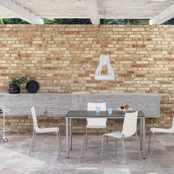 Eva Outdoor dining table by Bontempi in sunlit patio