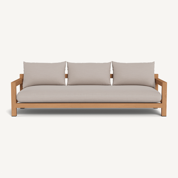 “Side profile of Pacific Teak Sofa – luxury outdoor seating with wide teak arms and weather-resistant fabric”