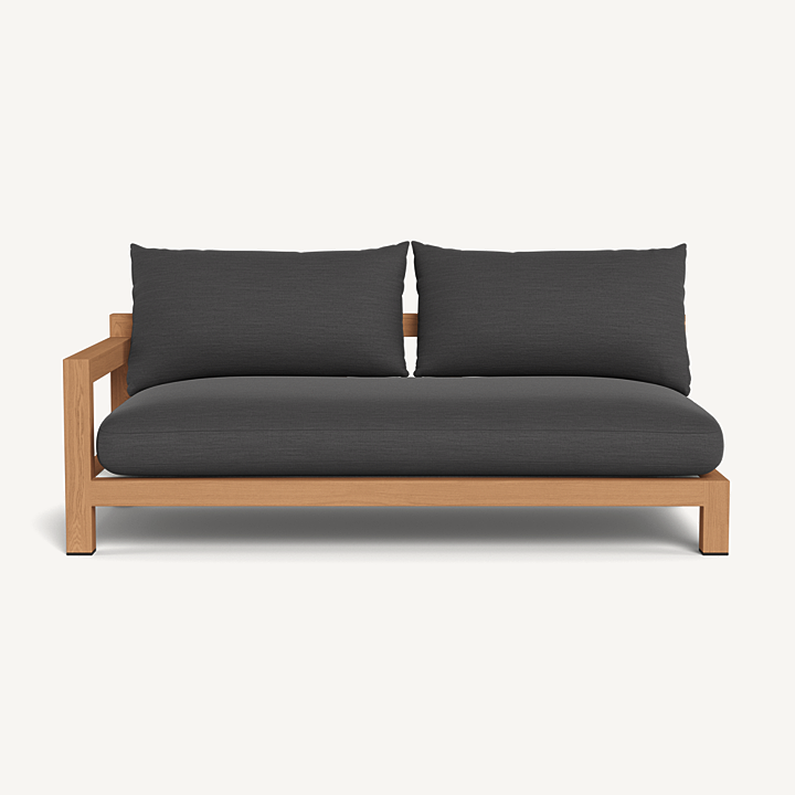 “Outdoor sectional teak sofa by Harbour – two-seater with one arm in minimalist coastal style”