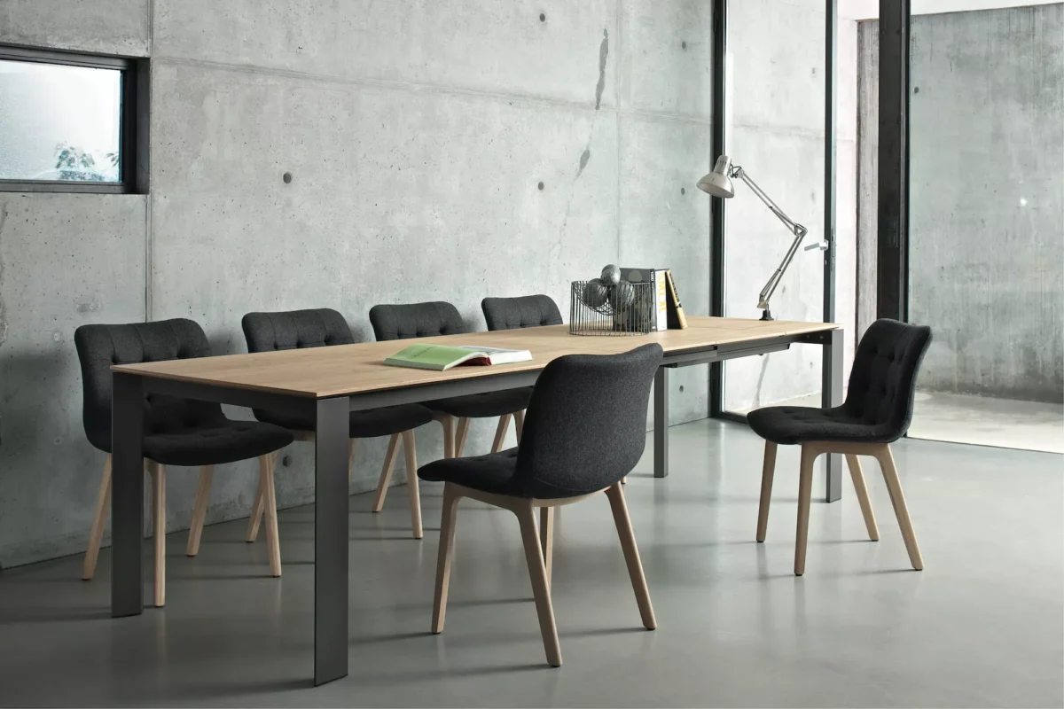 Bontempi Plague table paired with upholstered dining chairs