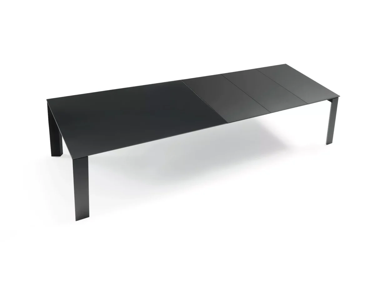 Pascal dining table extended to 240 cm, accommodating up to 12 seats, with a Canyon Oak melamine top and dark brass frame.