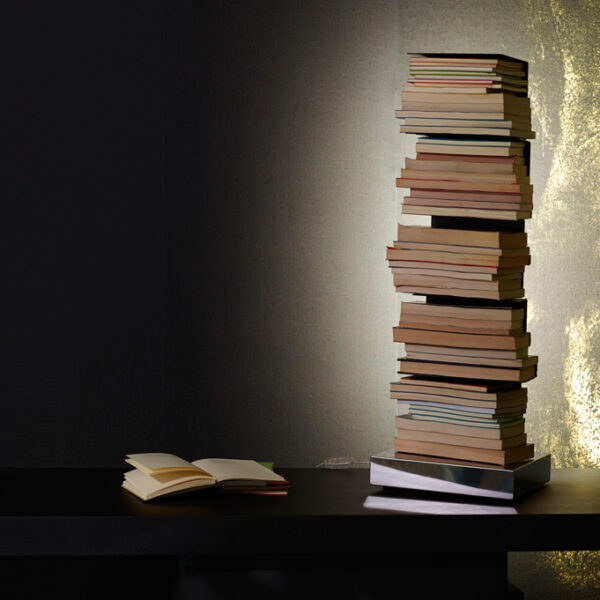 Ptolomeo Luce vertical bookcase by Opinion Ciatti in glossy white finish, featuring integrated LED lighting and stainless steel base, displayed in Royal Oak, Michigan showroom.