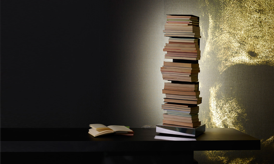 Ptolomeo Luce vertical bookcase by Opinion Ciatti in glossy white finish, featuring integrated LED lighting and stainless steel base, displayed in Royal Oak, Michigan showroom.