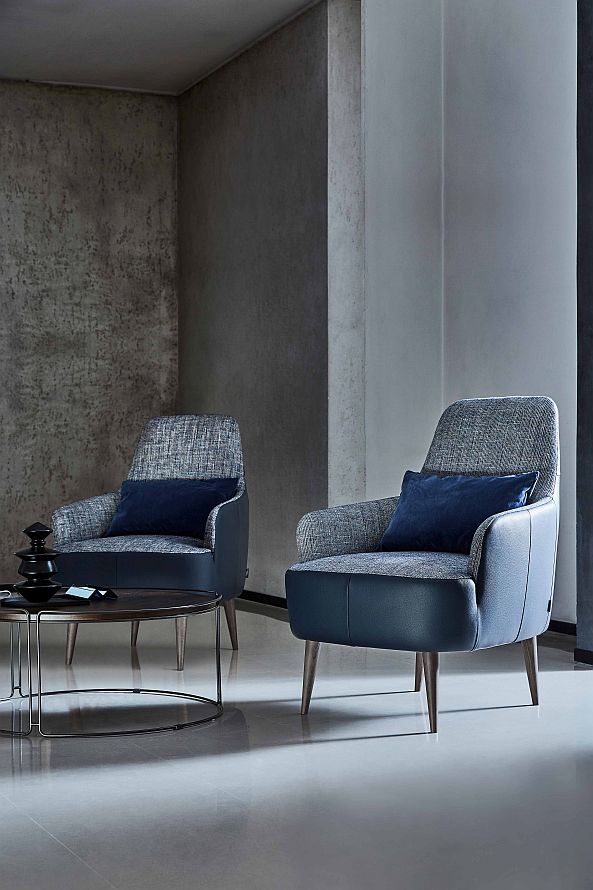 “Ray armchair by Ditre Italia – contemporary Italian lounge chair with curved backrest and sleek metal legs”