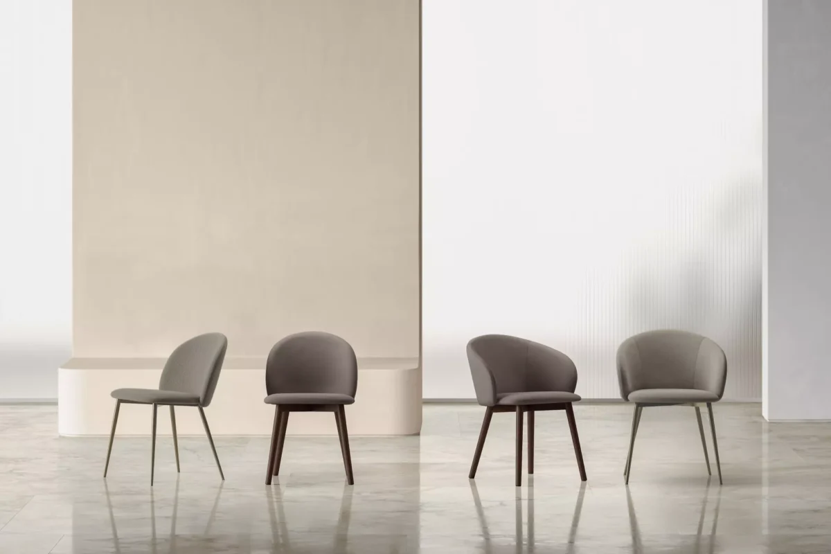 "Front view of Rebecca chair highlighting soft seat cushion and slender legs in a sophisticated finish."