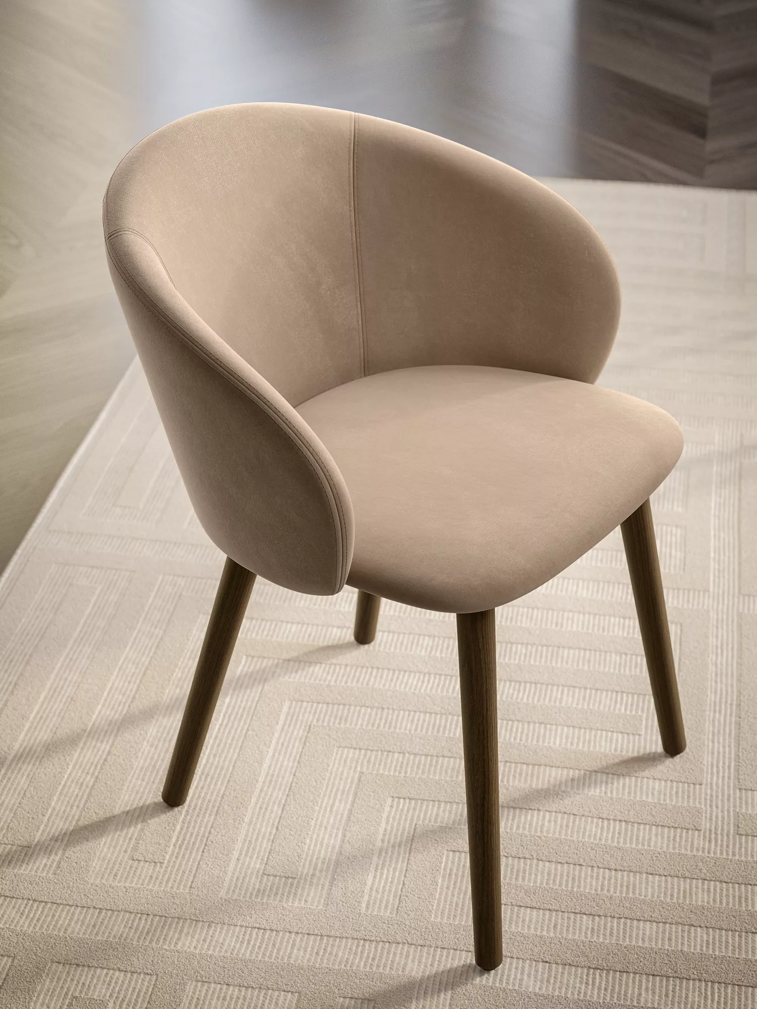 "Stylish Rebecca chair with organic curves, available in multiple upholstery colors and wood or metal frames."