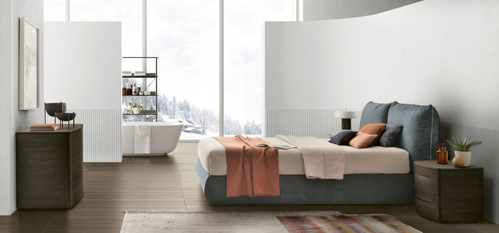 “Sogno bed by Tomasella – modern Italian bed with gently curved upholstered headboard and minimalist low-frame design”