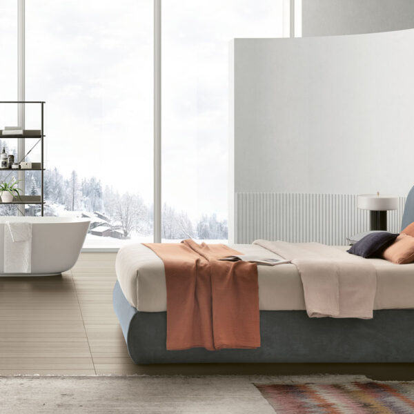“Sogno bed by Tomasella – modern Italian bed with gently curved upholstered headboard and minimalist low-frame design”