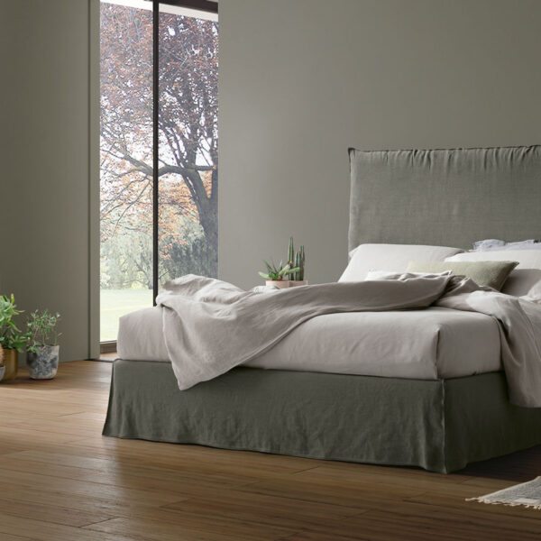 “Hera bed by Tomasella – modern Italian bed with tall upholstered headboard and elegant vertical stitching”