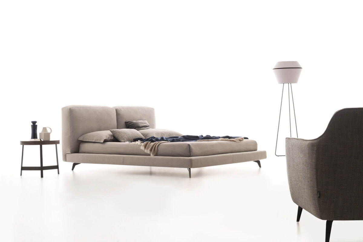 “Sound upholstered bed by Ditre Italia – stylish Italian design featuring a cushioned headboard and refined structure”