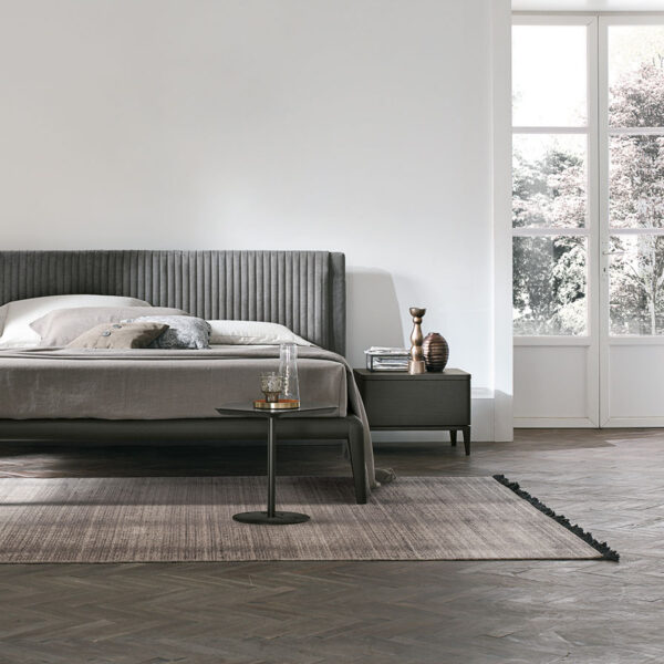 “Marlena bed by Tomasella – modern Italian bed with curved upholstered headboard and soft padded detailing”