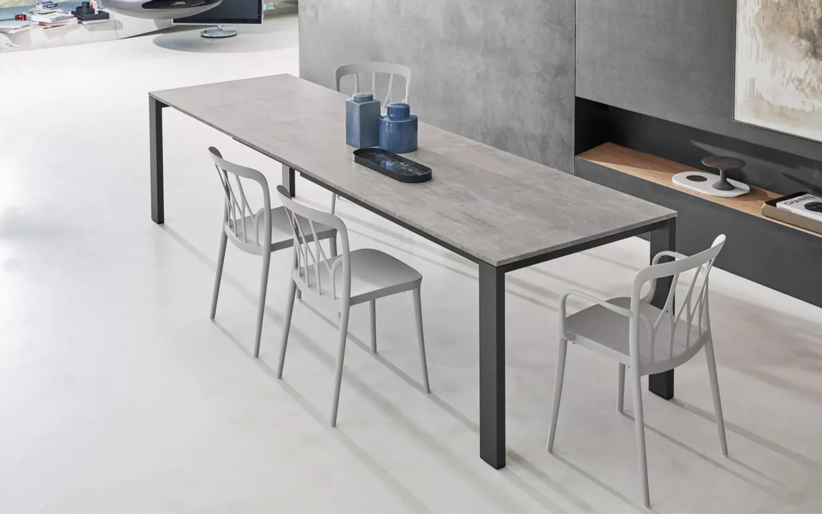 Bontempi Galaxy table featuring sleek curved legs and glass top