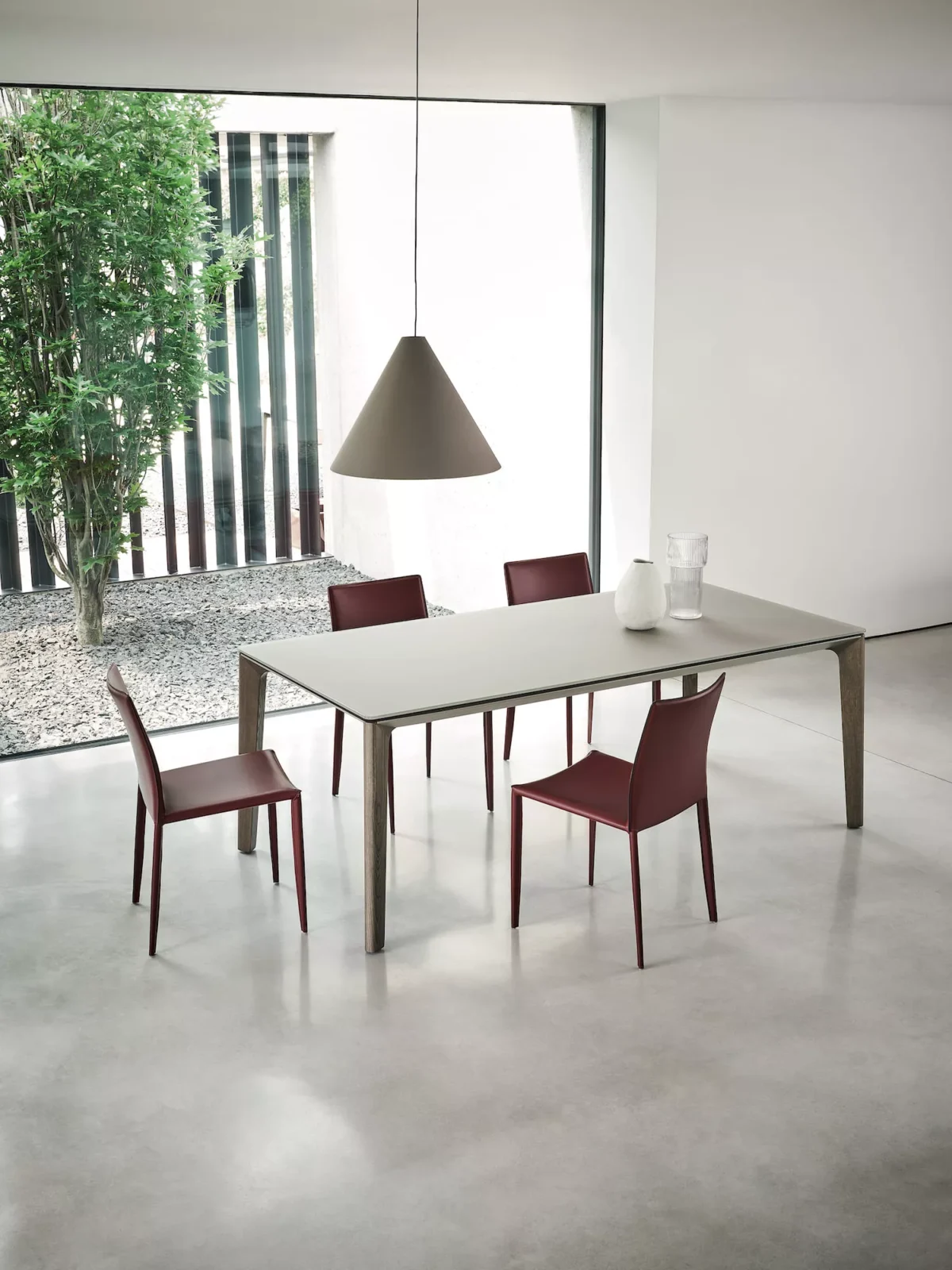 Modern dining room showcasing Linda chairs by Bontempi around a glass-top table