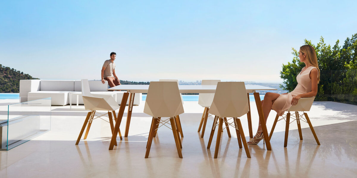 "FAZ WOOD dining table by Vondom offering a balance of modern form and natural materials."