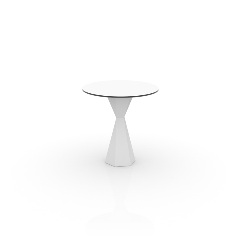 "VERTEX dining table by Vondom with sharp geometric lines and sculptural base design."