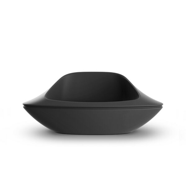 White Vondom UFO Lounge Chair placed in a modern garden with greenery.