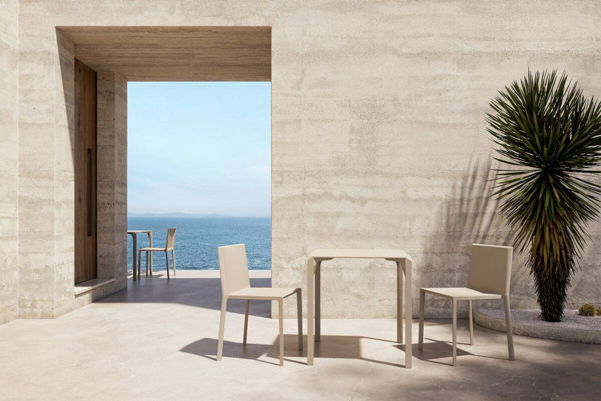 "Angular and sleek QUARTZ table by Vondom with weather-resistant materials and bold lines."