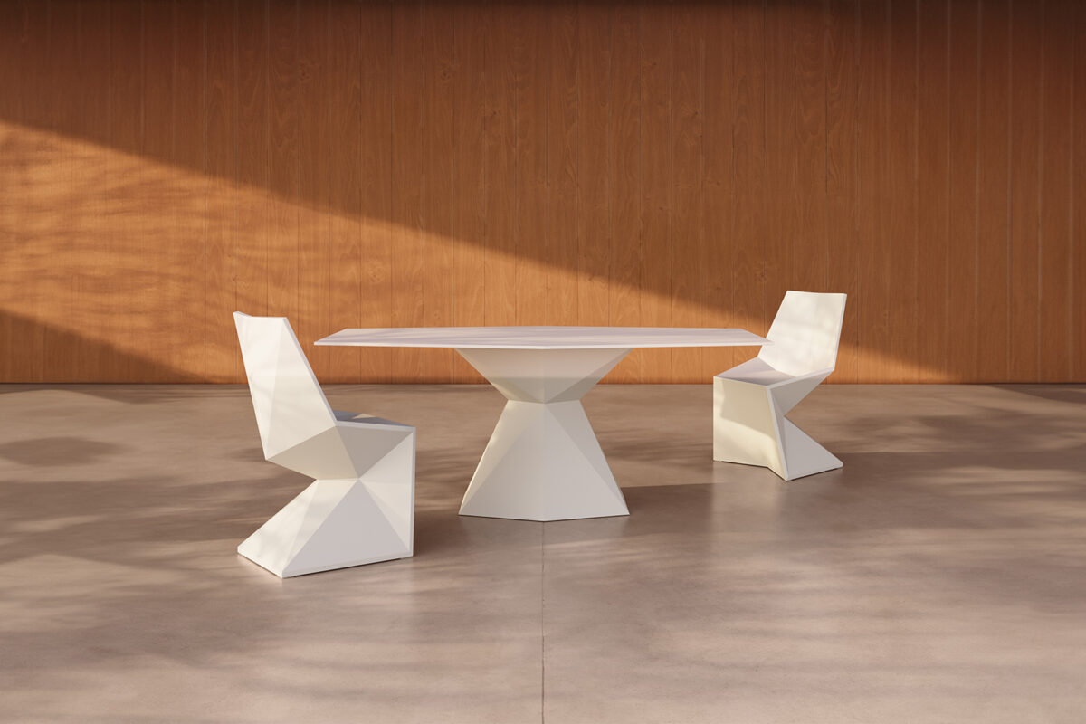 "Artistic modern table from the VERTEX series by Vondom, blending form and function."
