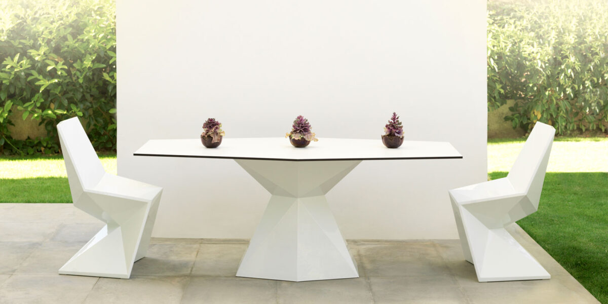 "Vondom VERTEX table with origami-inspired design and sharp-edged elegance."