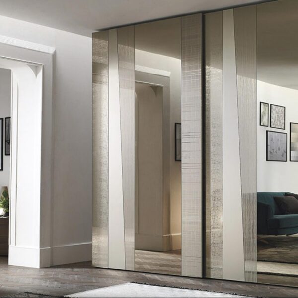 “Madras Sliding wardrobe by Tomasella – modern Italian wardrobe with textured sliding doors and integrated handle profile”