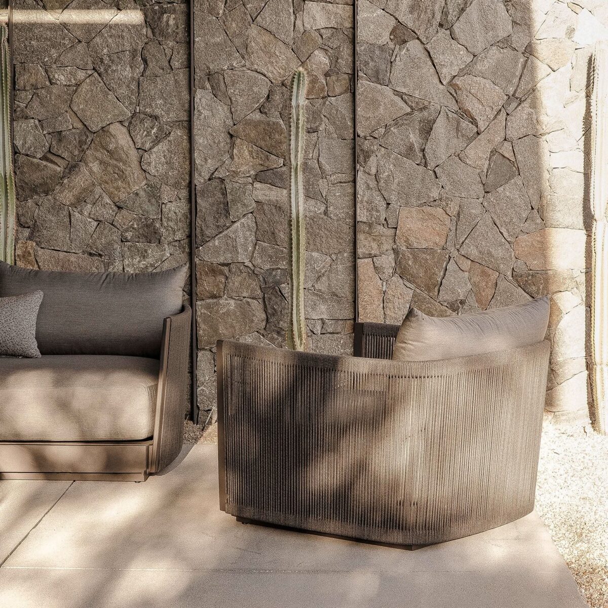 “Antigua Swivel Chair in outdoor space – elegant, functional design”